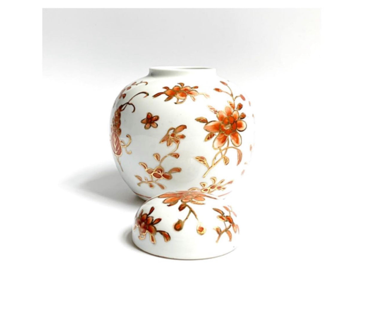 A Ginger jar. With gold gilding and orange flowery designs.