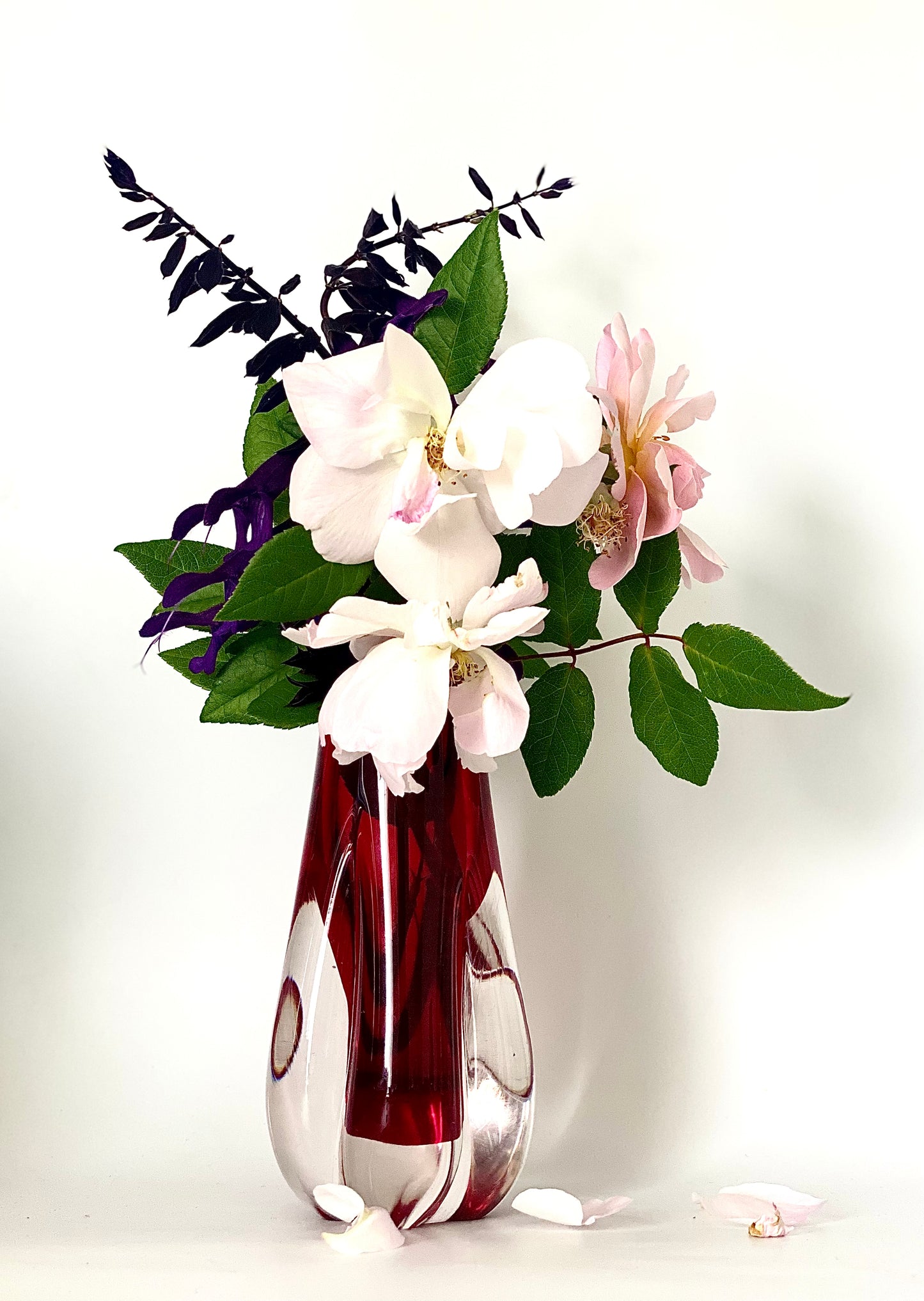 A Murano Sommerso vase cased in cranberry red and clear glass.