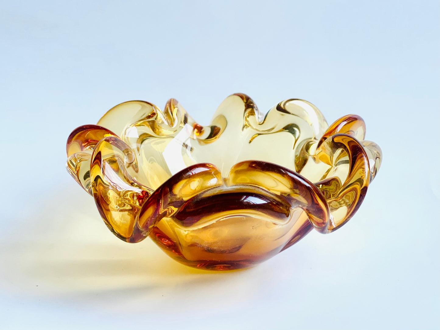 A Josef Hospodska Czech glass bowl in tiger orange.