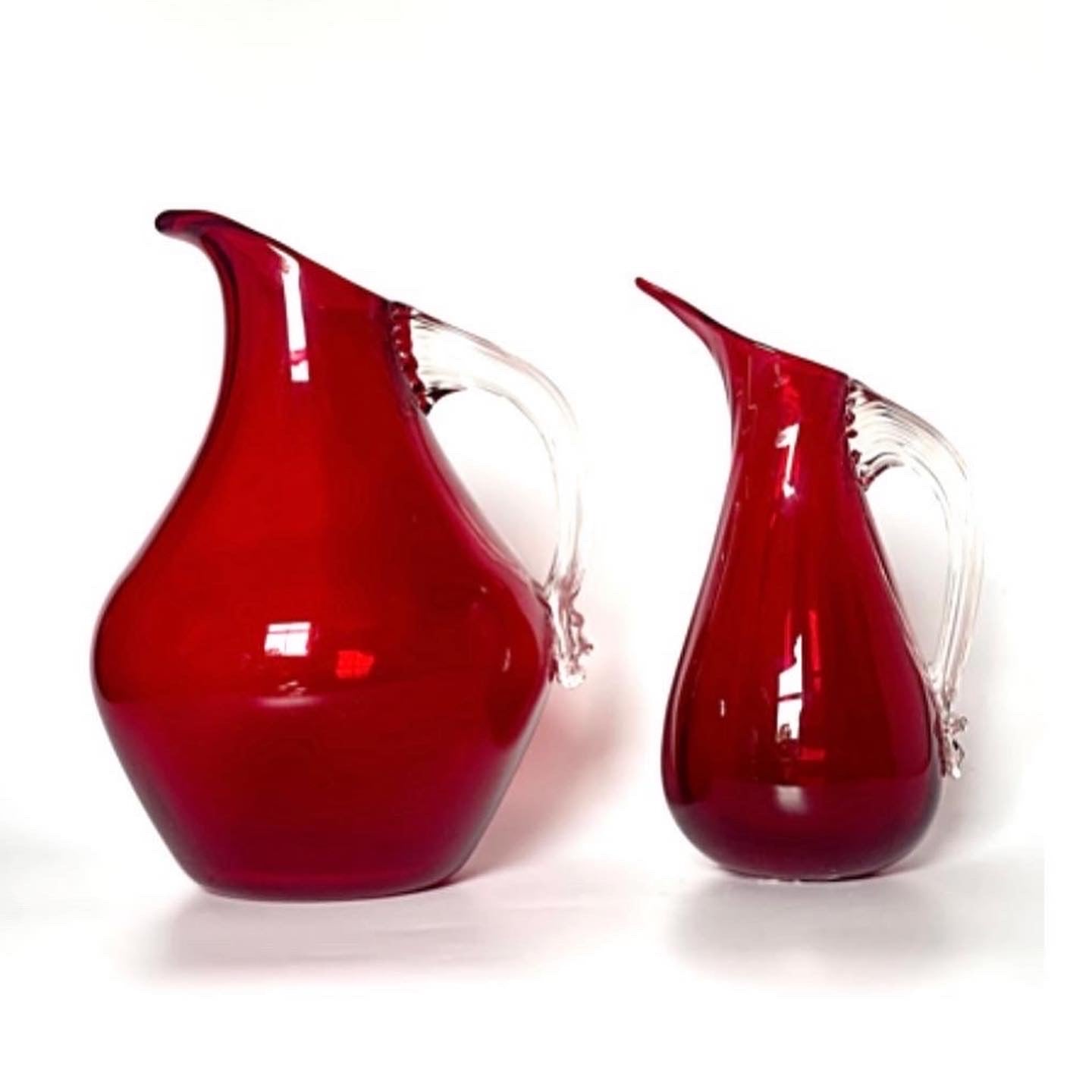 A handsome pair of cranberry red glass jugs.