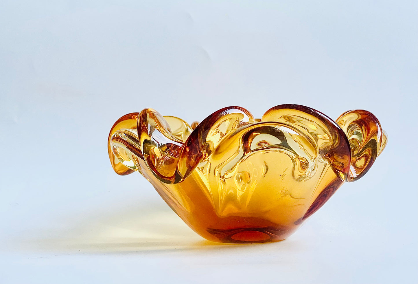 A Josef Hospodska Czech glass bowl in tiger orange.