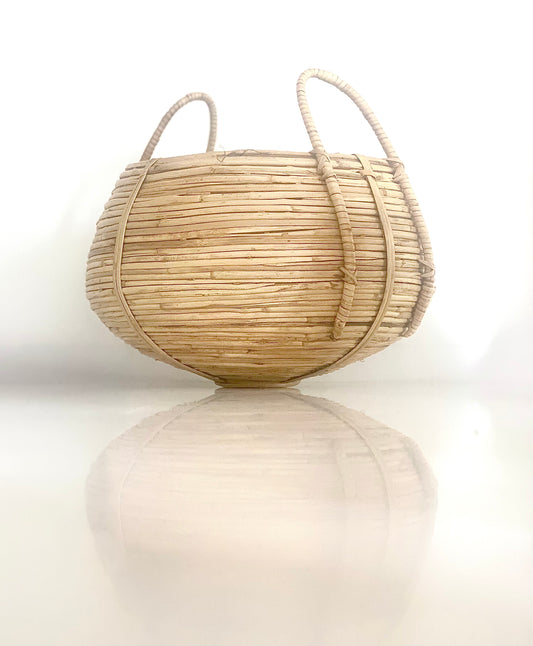 An African shaped rattan weaved basket.