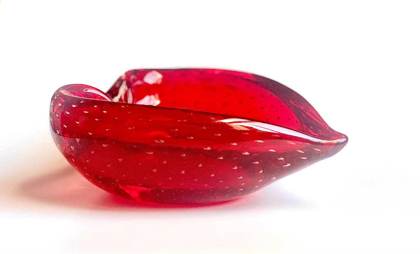 A Murano deep cherry red glass heart bowl .