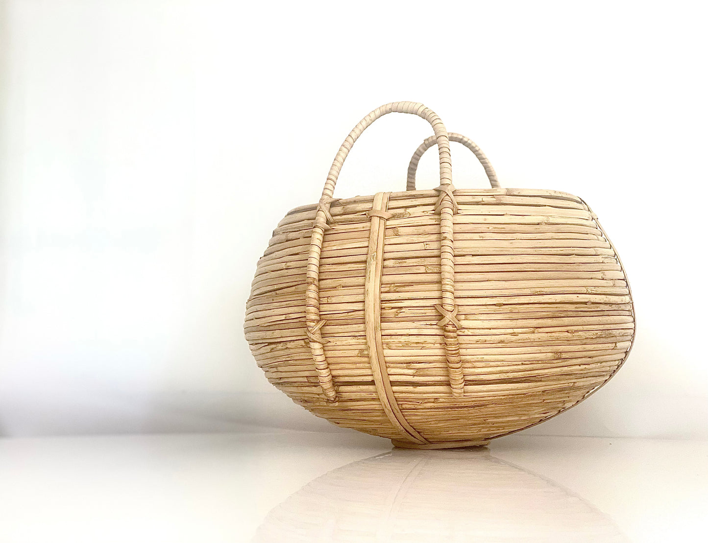 An African shaped rattan weaved basket.