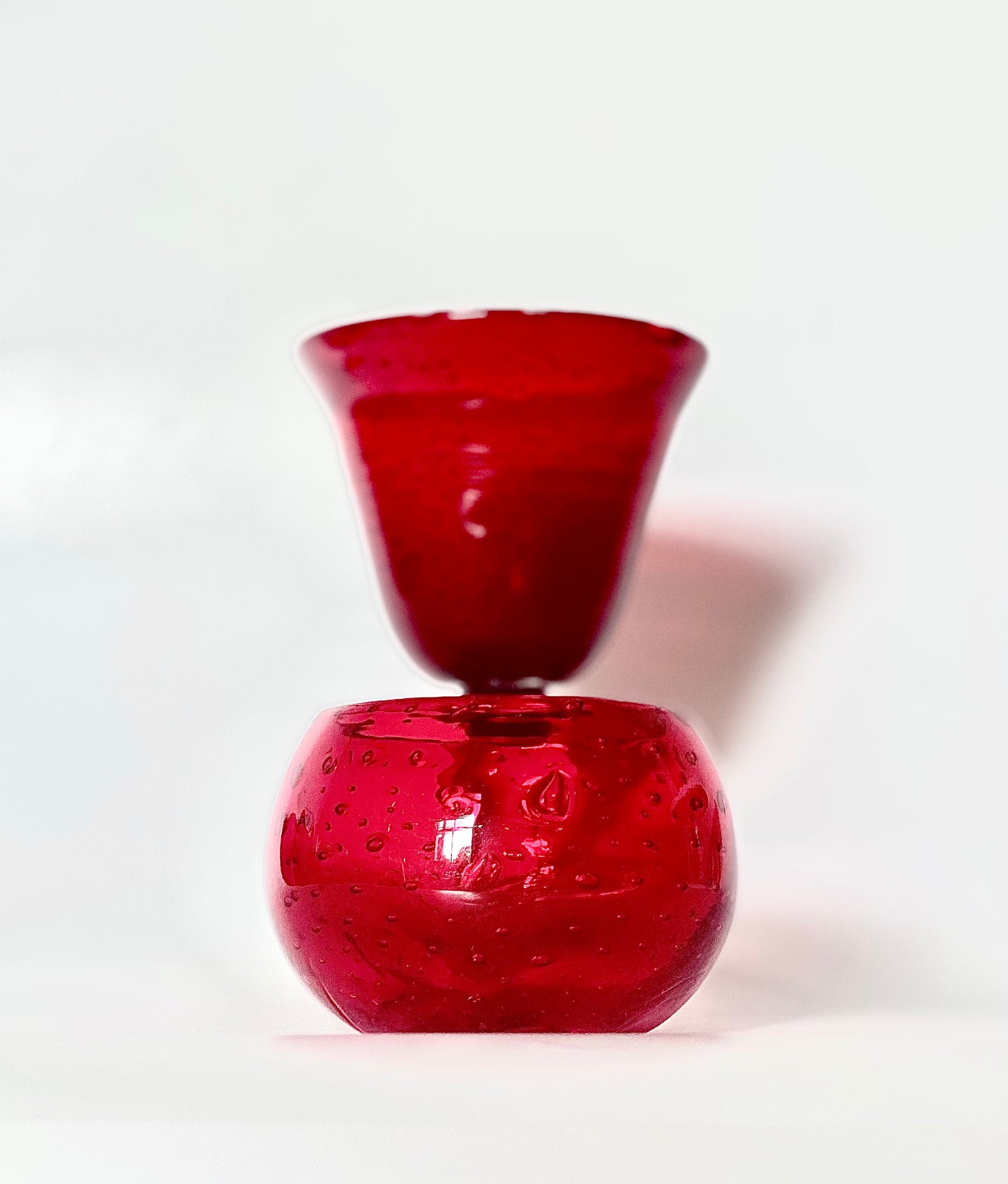 A Murano cranberry glass goblet and a bowl.