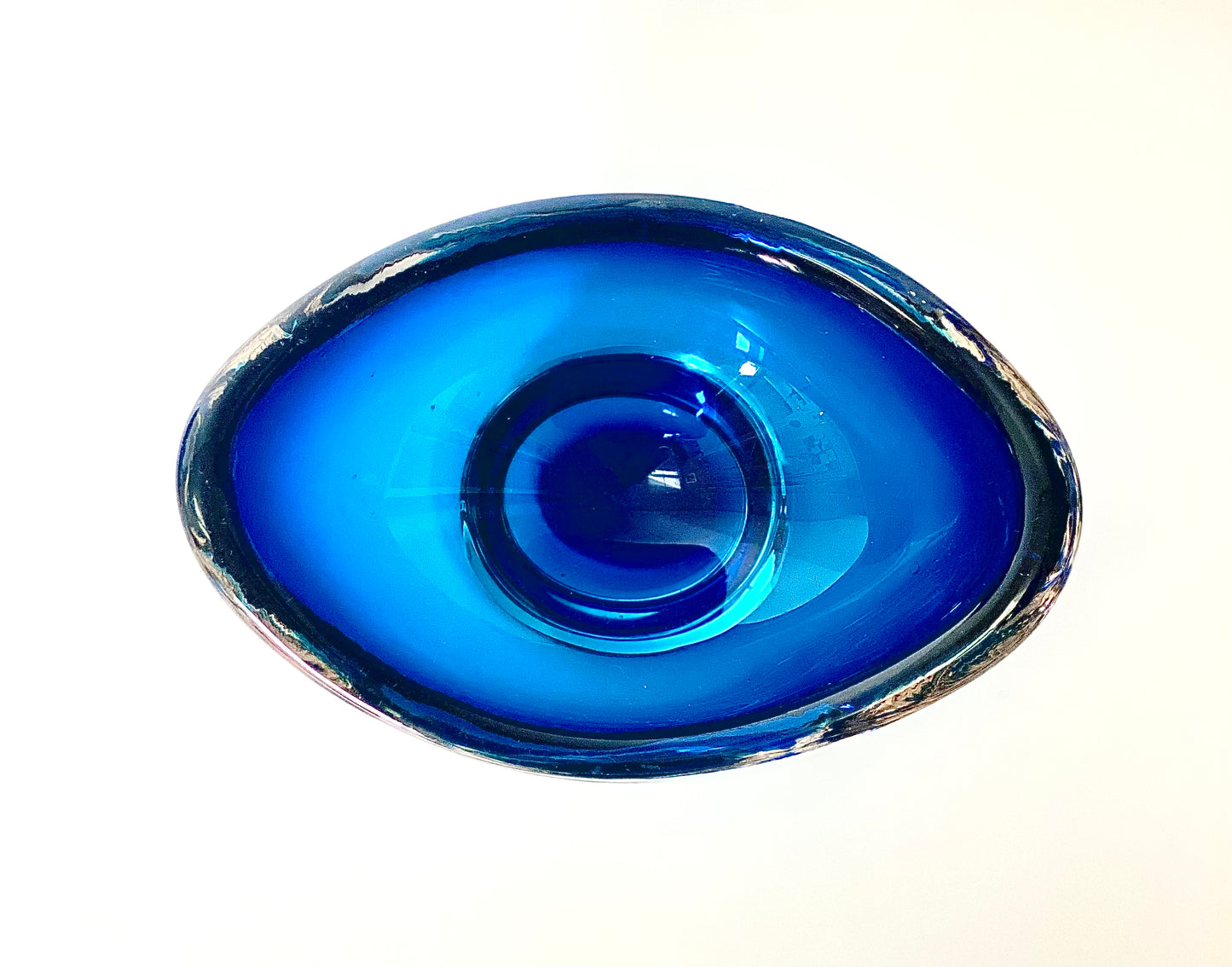 A Whitefriars boat shaped glass bowl in a deep indigo blue.