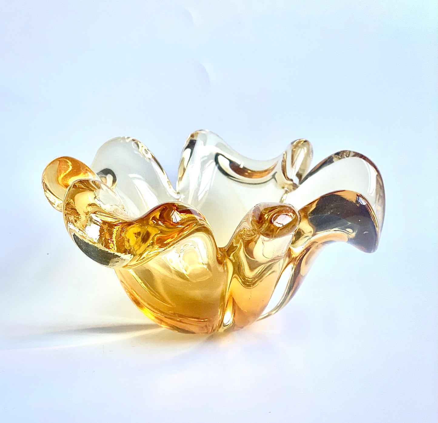 A Murano glass clover leaf bowl in a golden yellow