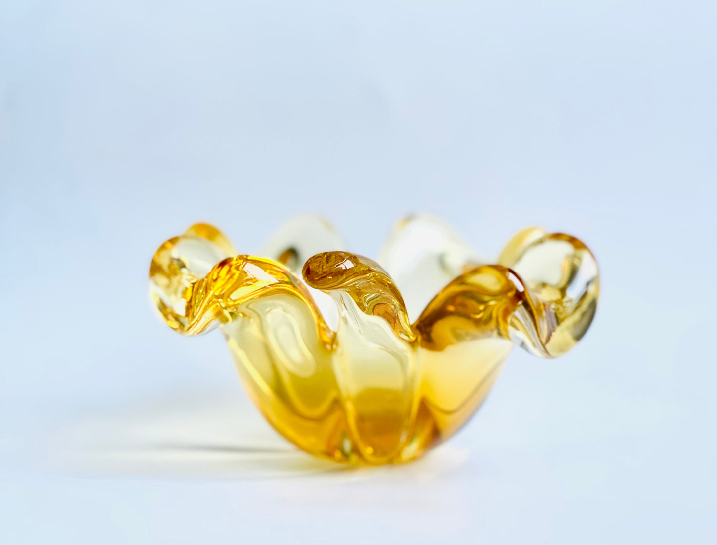 A Murano glass clover leaf bowl in a golden yellow