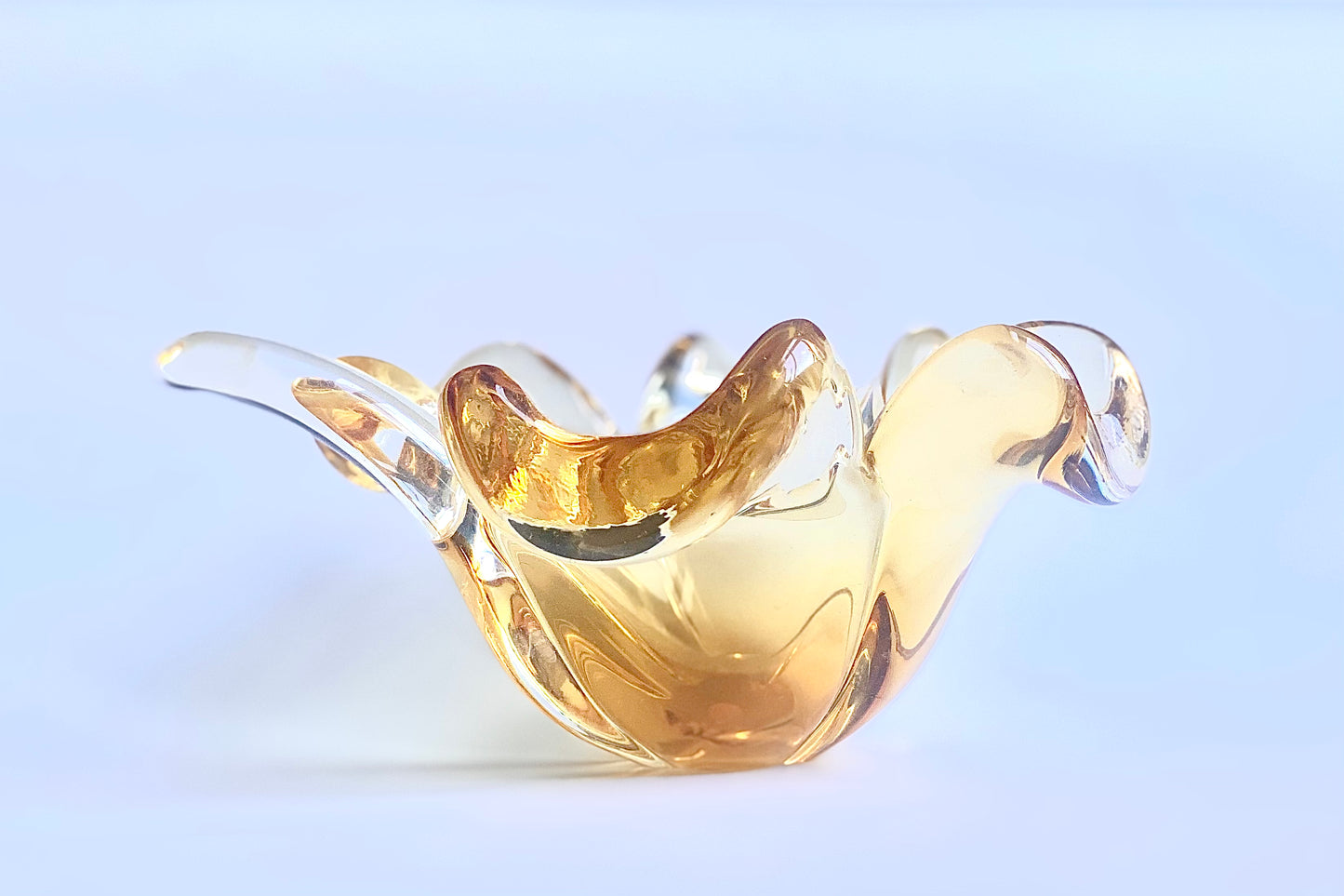 A Murano glass clover leaf bowl in a golden yellow