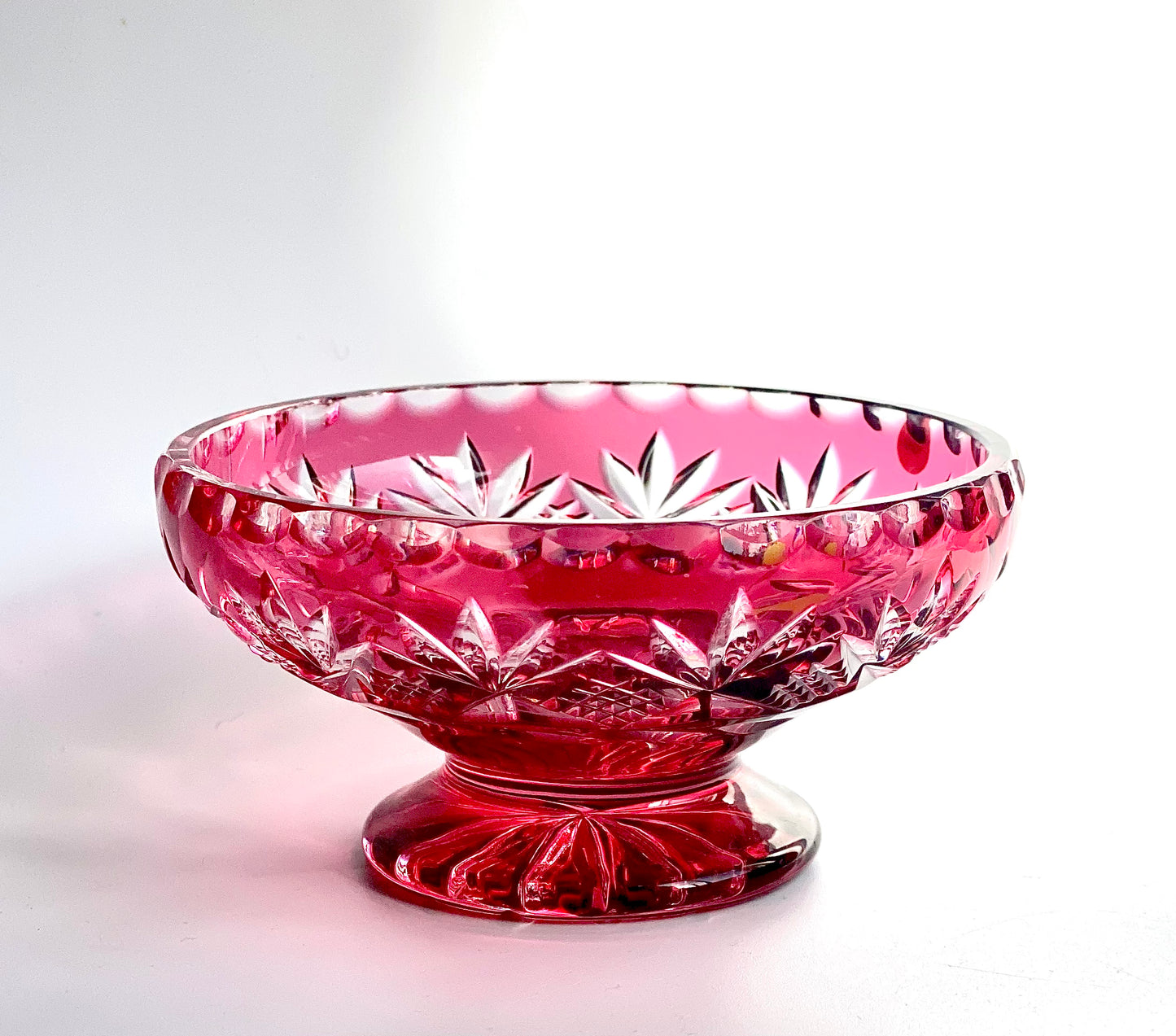 Cranberry red cut glass pedestal dish.