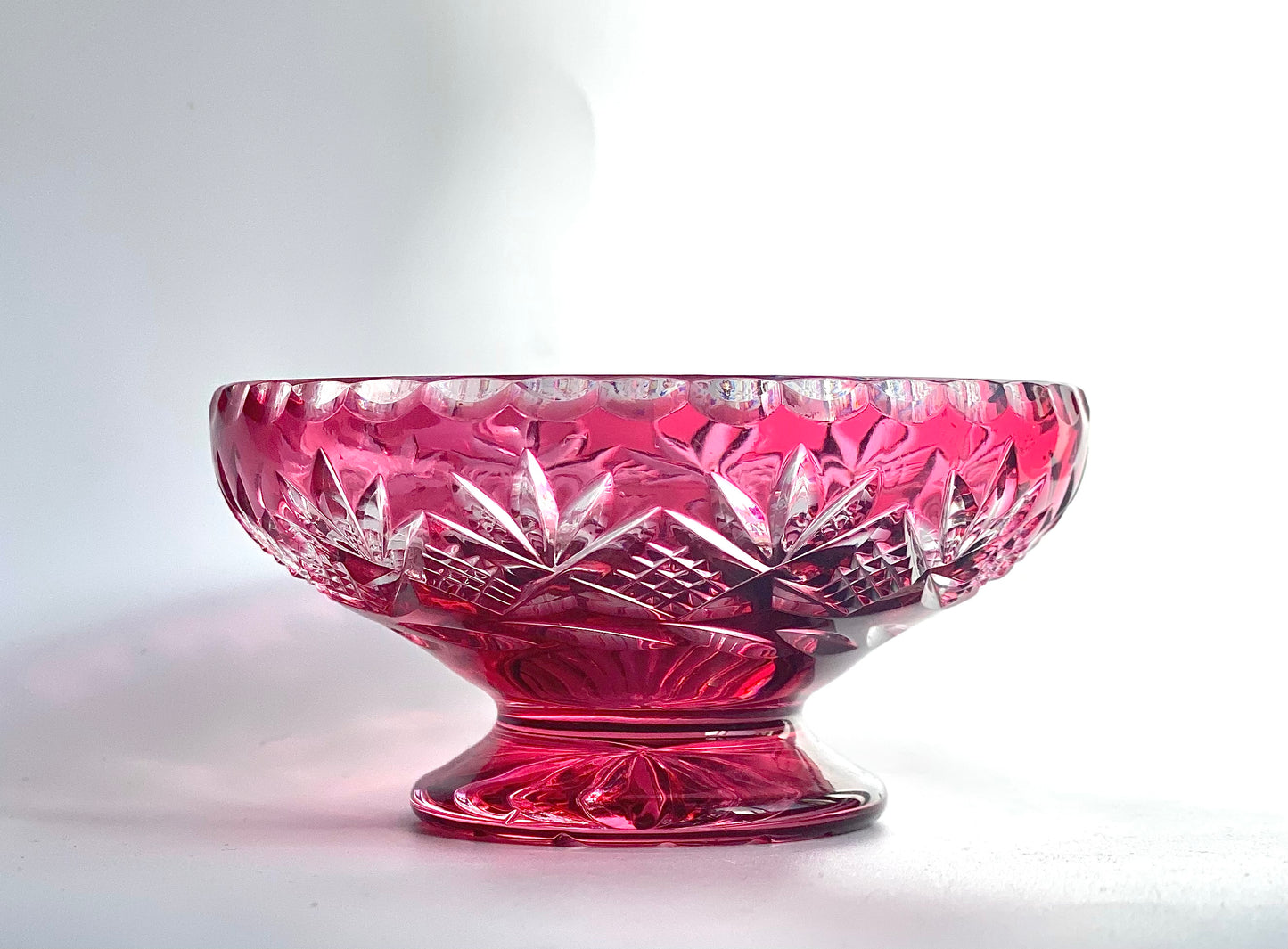 Cranberry red cut glass pedestal dish.