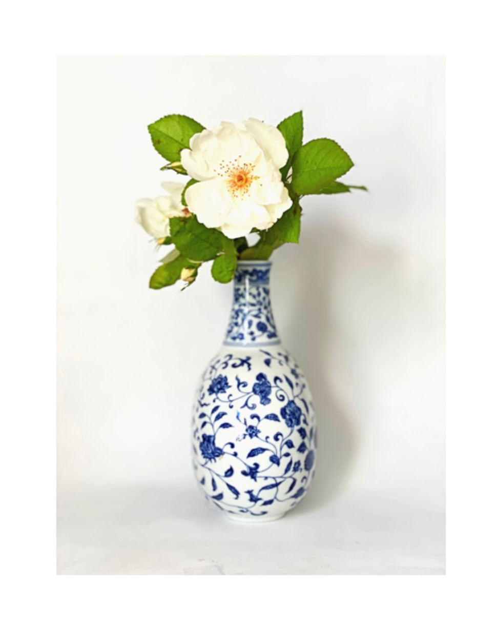 A blue and white porcelain oval jug, vase and candlestick .