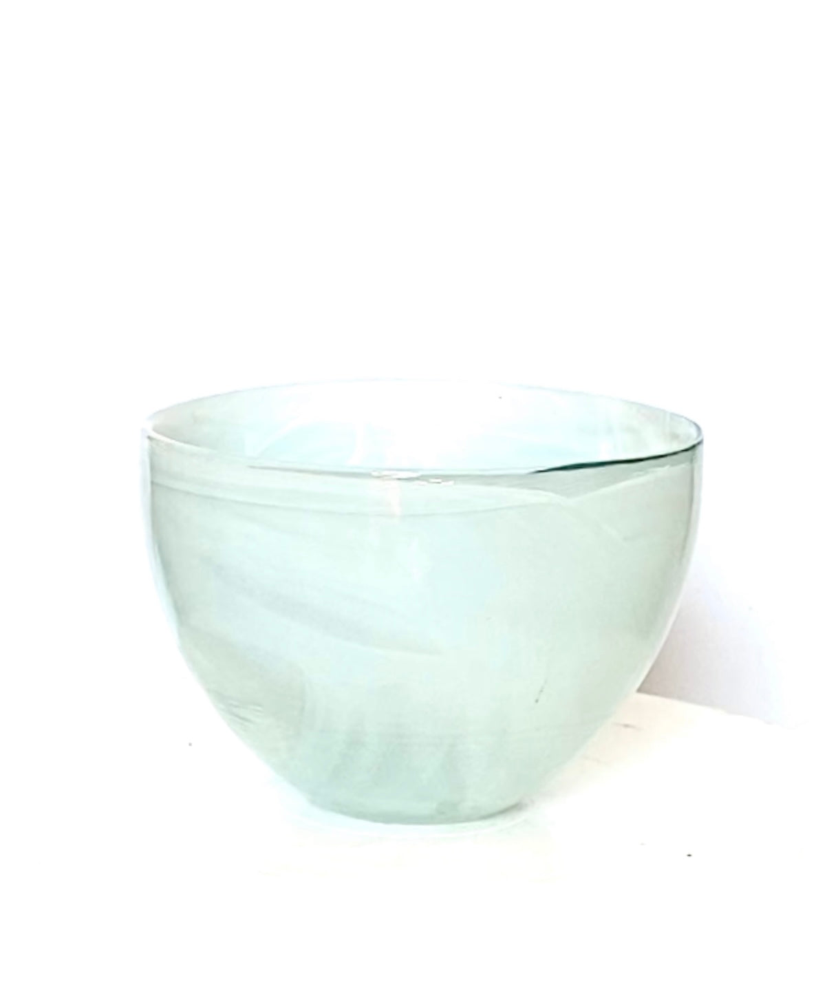 A pair of alabaster bowls in a soft mint green.