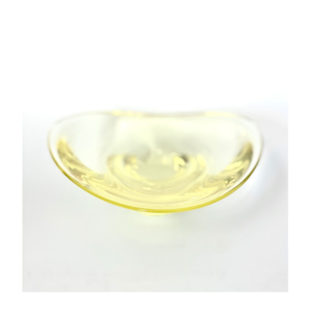 A Holmegaard glass bowl in lemon yellow