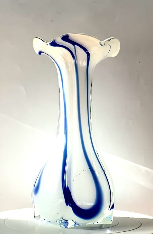 An opaque white glass vase with a Curzon Blue swirl