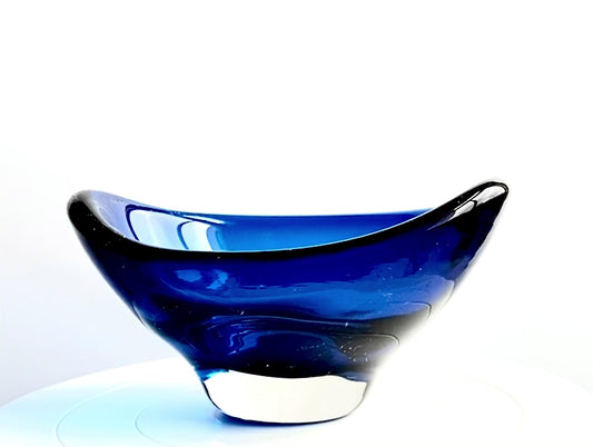 A Whitefriars boat shaped glass bowl in a deep indigo blue.