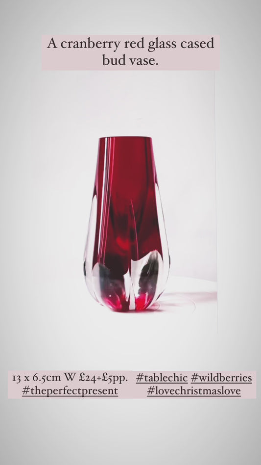 A Murano Sommerso vase cased in cranberry red and clear glass.