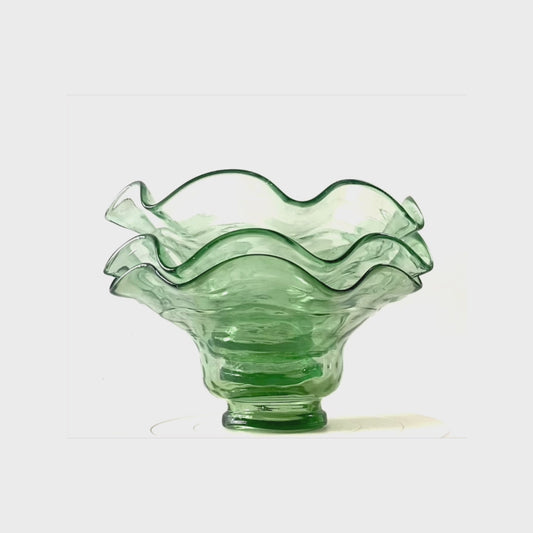 A set of 3 scalloped edged glass bowls in bottle green.