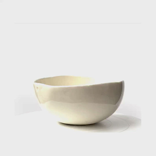 A porcelain bowl in a clear stoneware glaze.