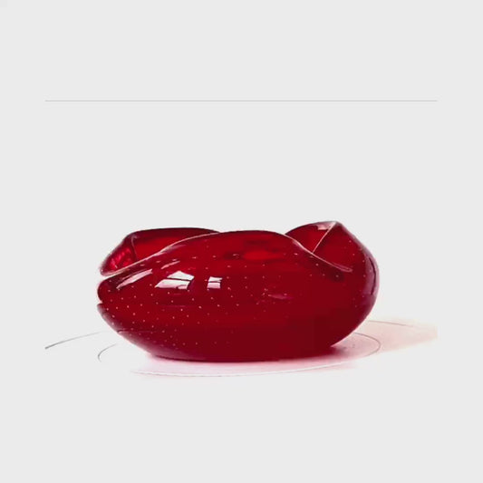 A Murano cherry red glass bowl.