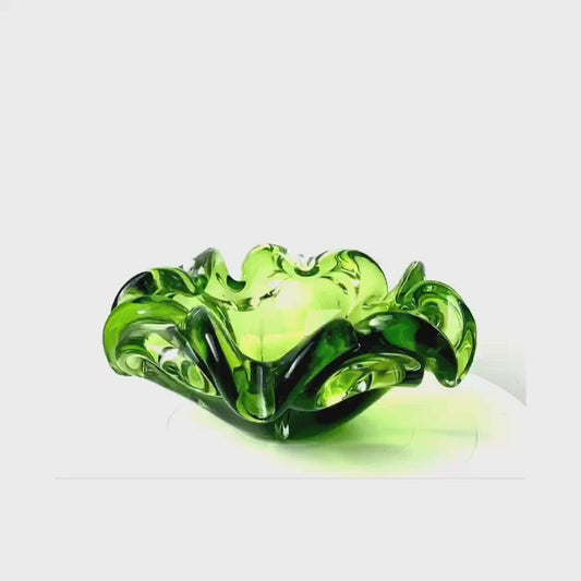 A Josef Hospodska Czech glass bowl in pea green .