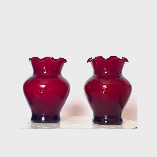 A pair of Cranberry red glass vases with a frill rim.