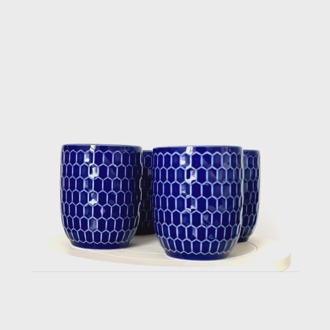 A navy blue and white ceramic cup / mug