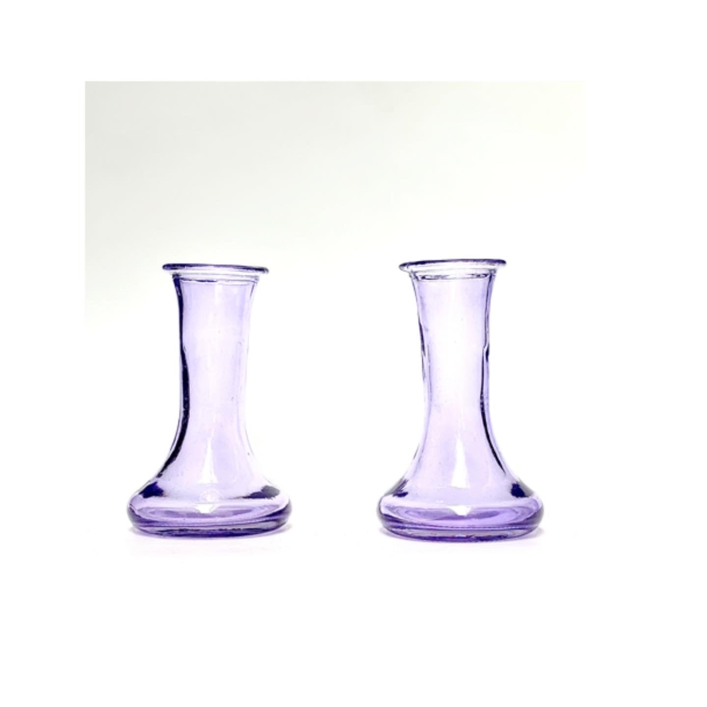 A pair of soft violet glass candlesticks plus four candles of your choice .