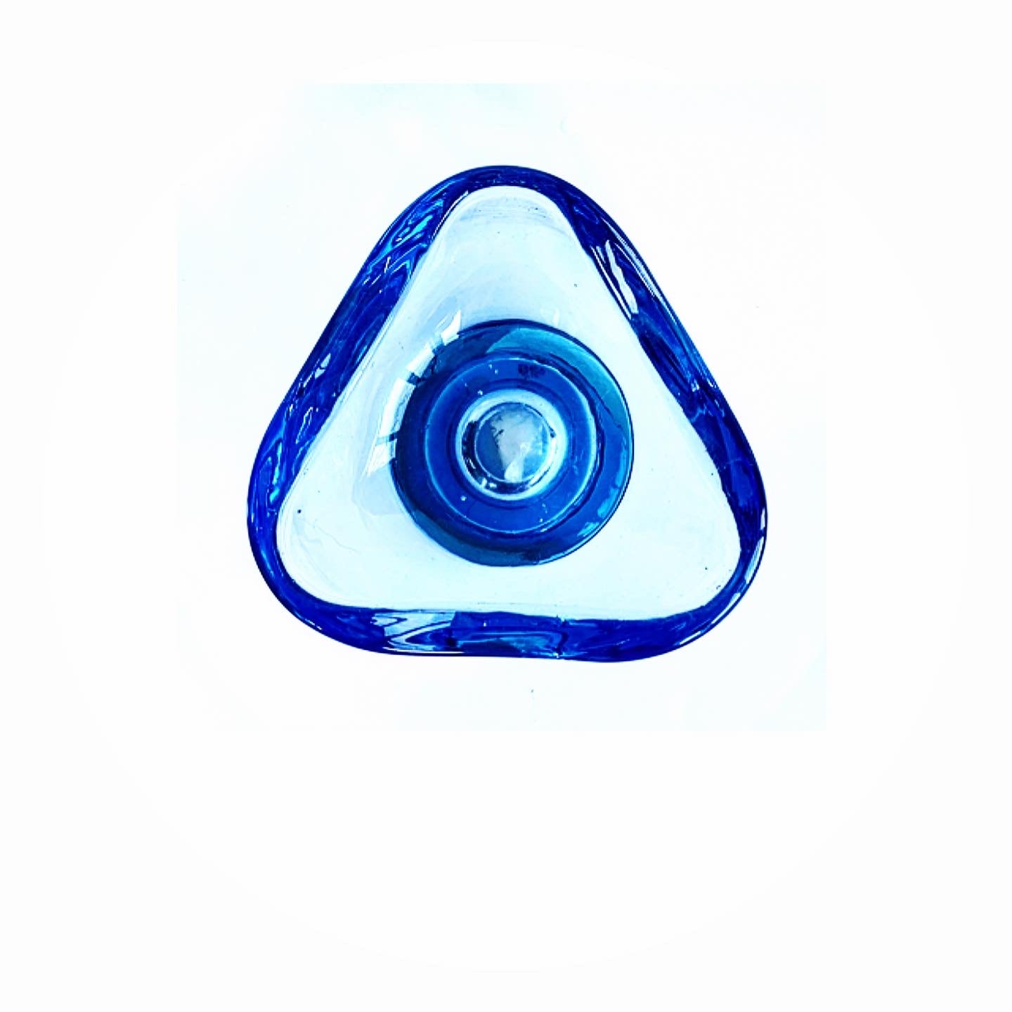 A triangular sky blue glass bowl.