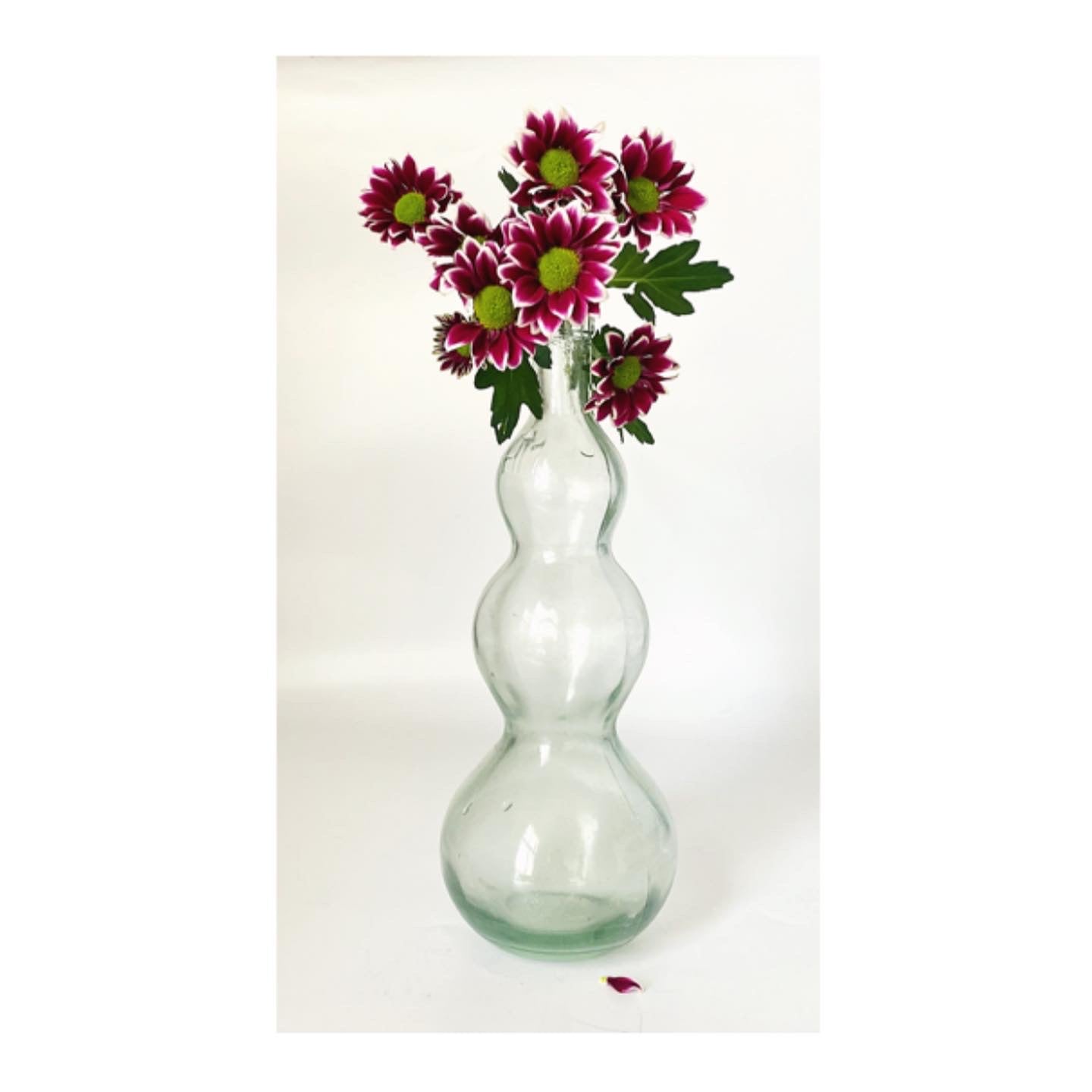 A pair of vintage glass vases and jug bottles.