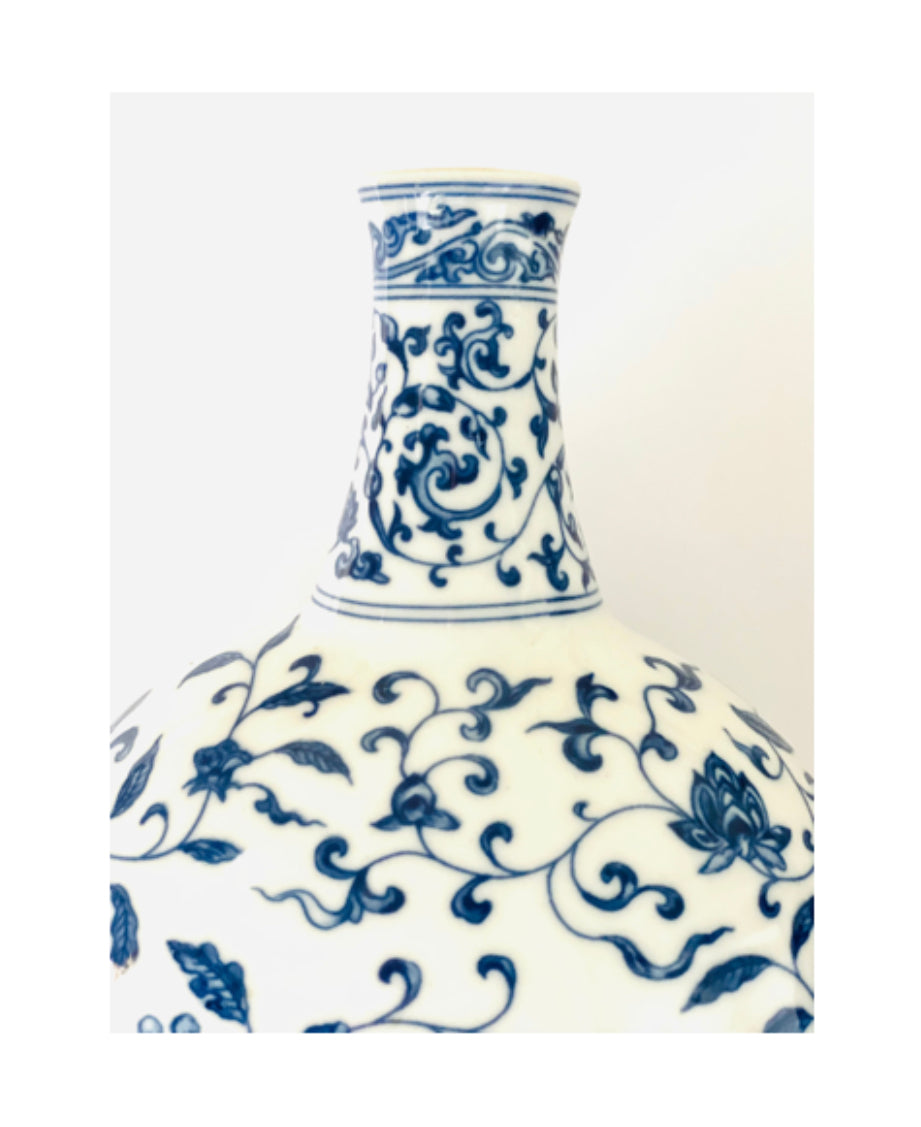 A blue and white porcelain oval jug, vase and candlestick .