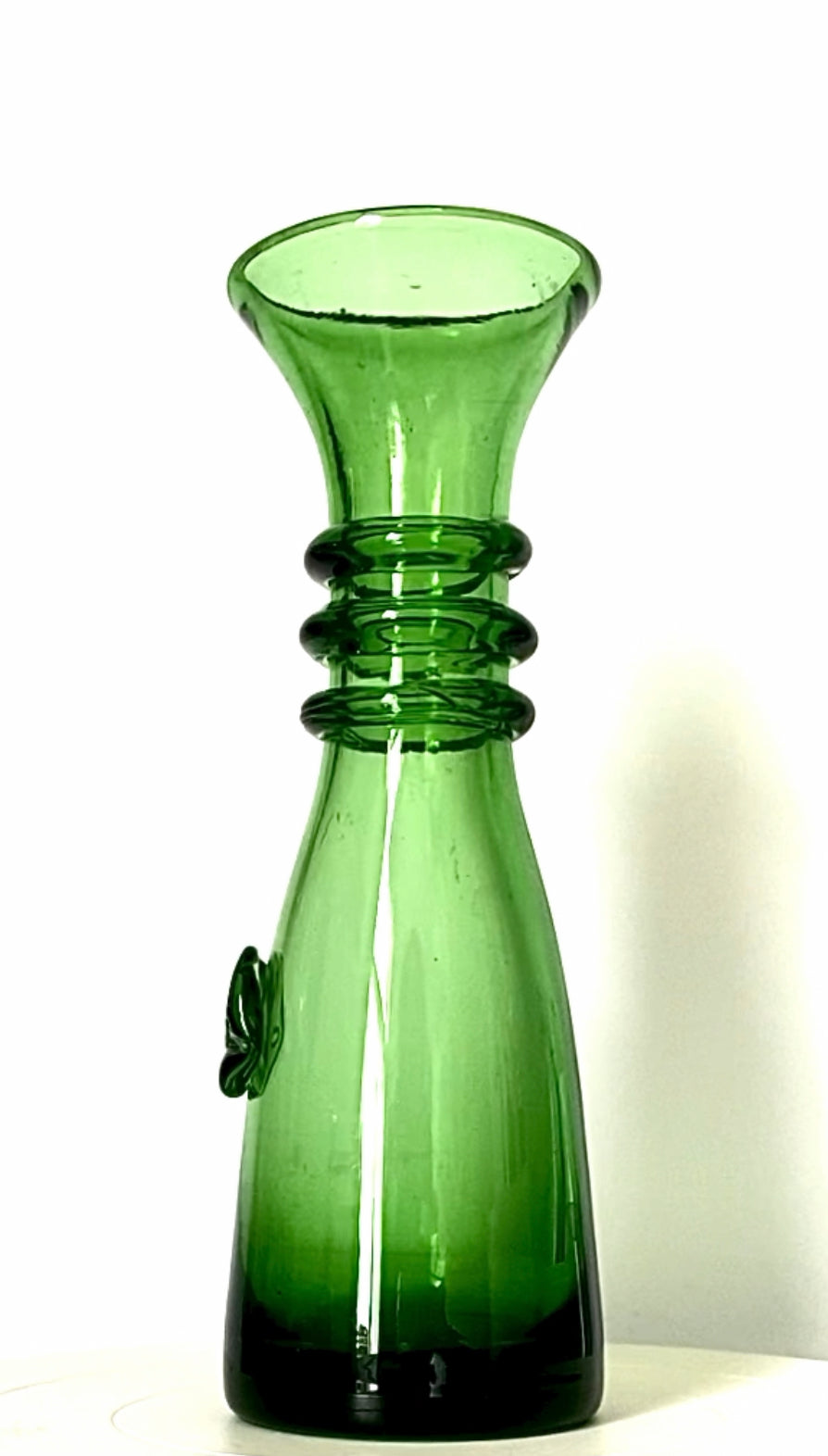 A vintage fern green glass vase or jug