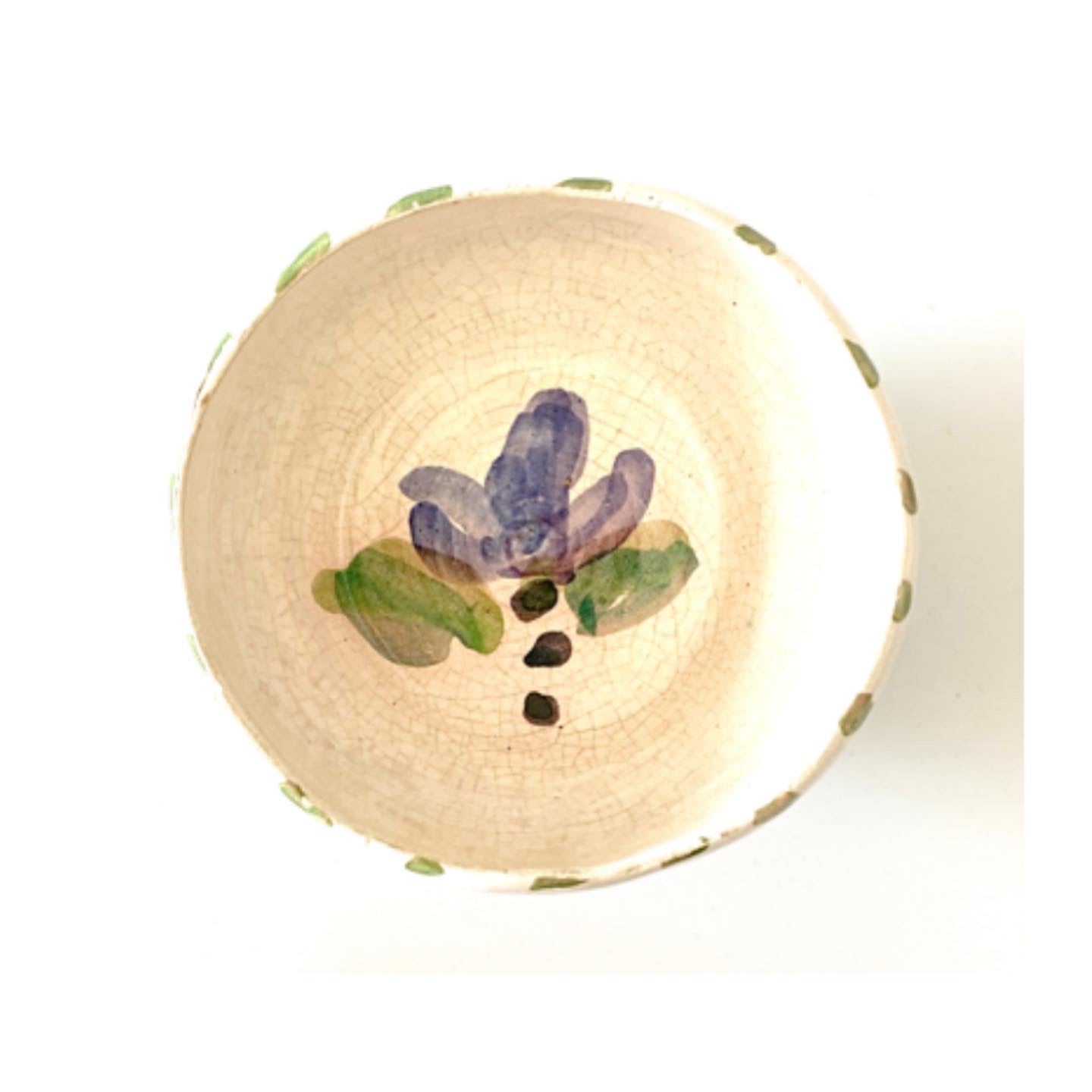 A crackled glaze earthenware ceramic pot with handpainted flowers.