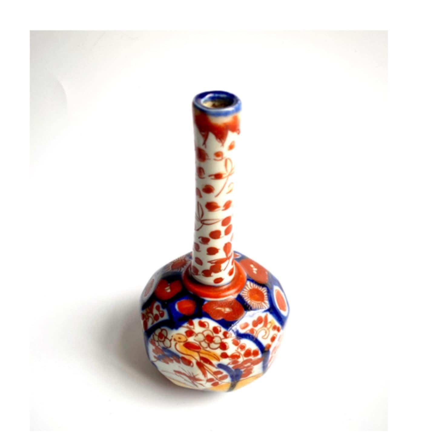 An Imari ceramic bud vase .