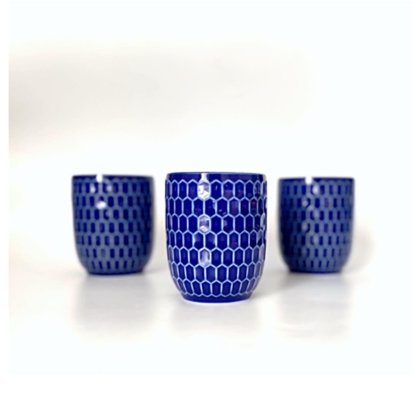 A navy blue and white ceramic cup / mug