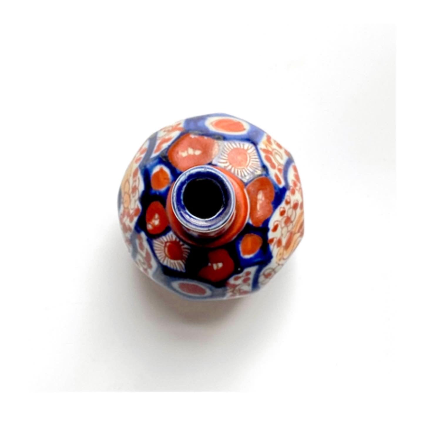 An Imari ceramic bud vase .