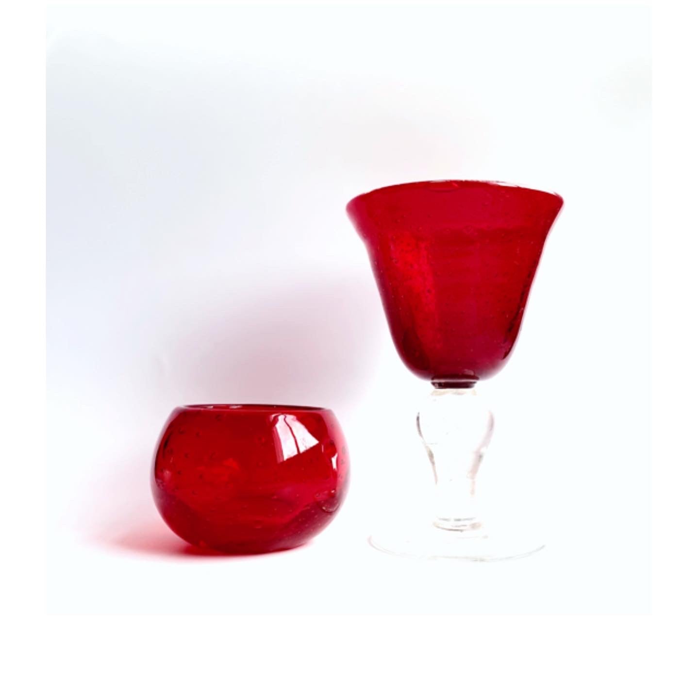 A Murano cranberry glass goblet and a bowl.