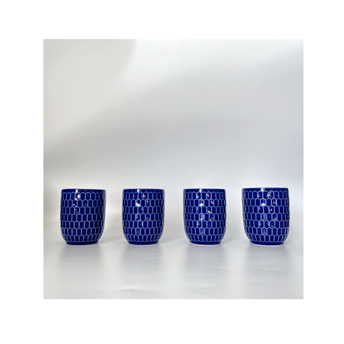 A navy blue and white ceramic cup / mug