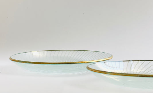 A pair of Whitefriars glass pin dishes with a gold lustred rim.