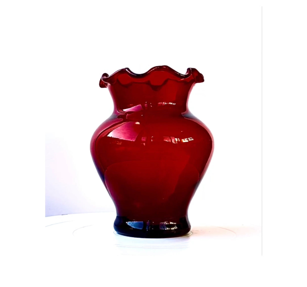 A pair of Cranberry red glass vases with a frill rim.