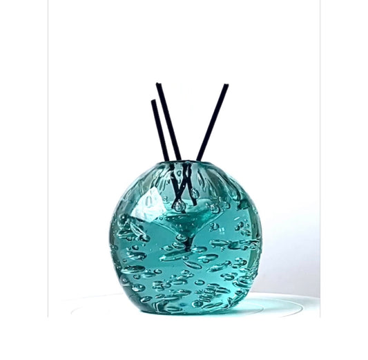 A Murano paperweight / room fragrance diffuser in sea green