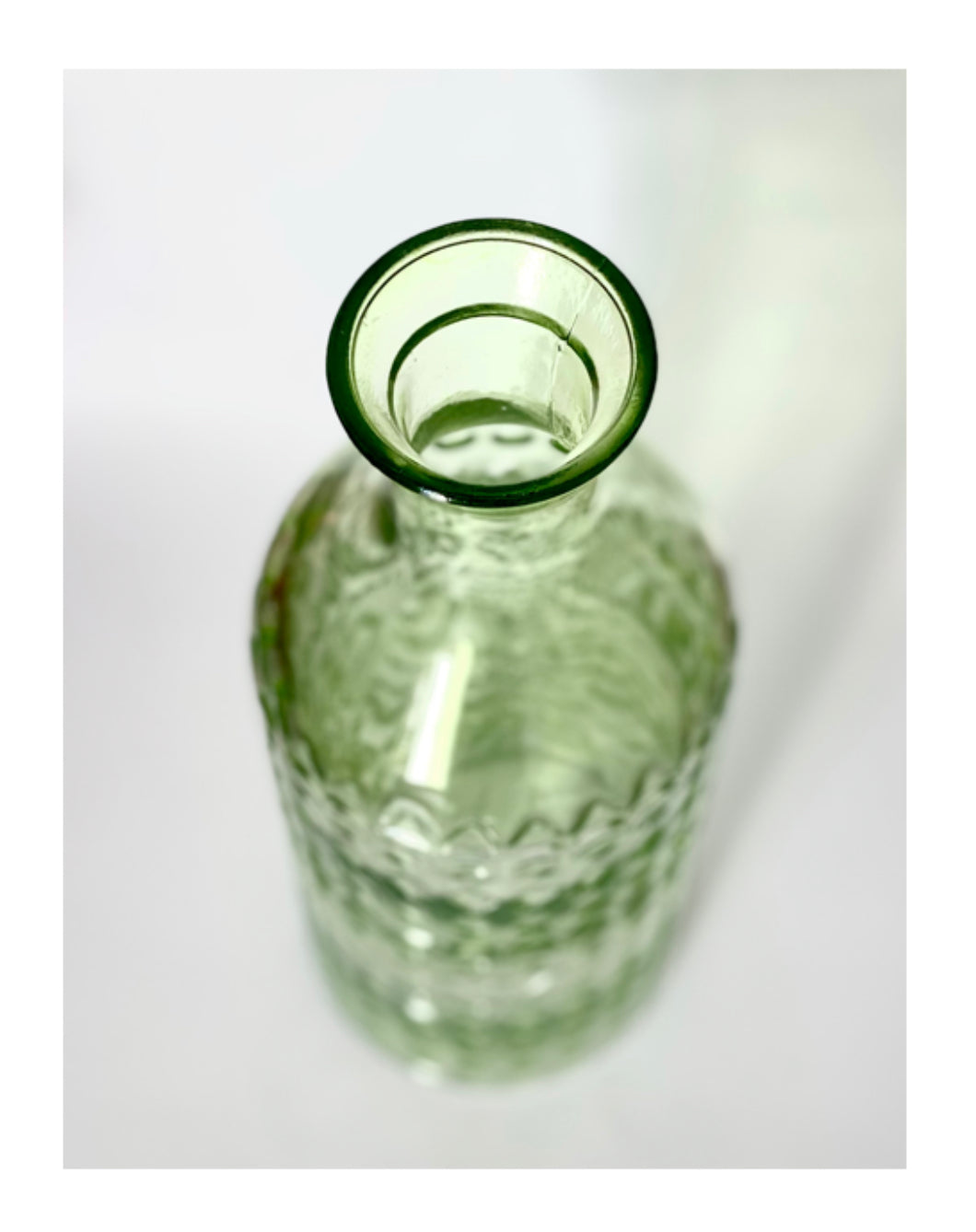 A Lime green glass vase , jug or bottle.