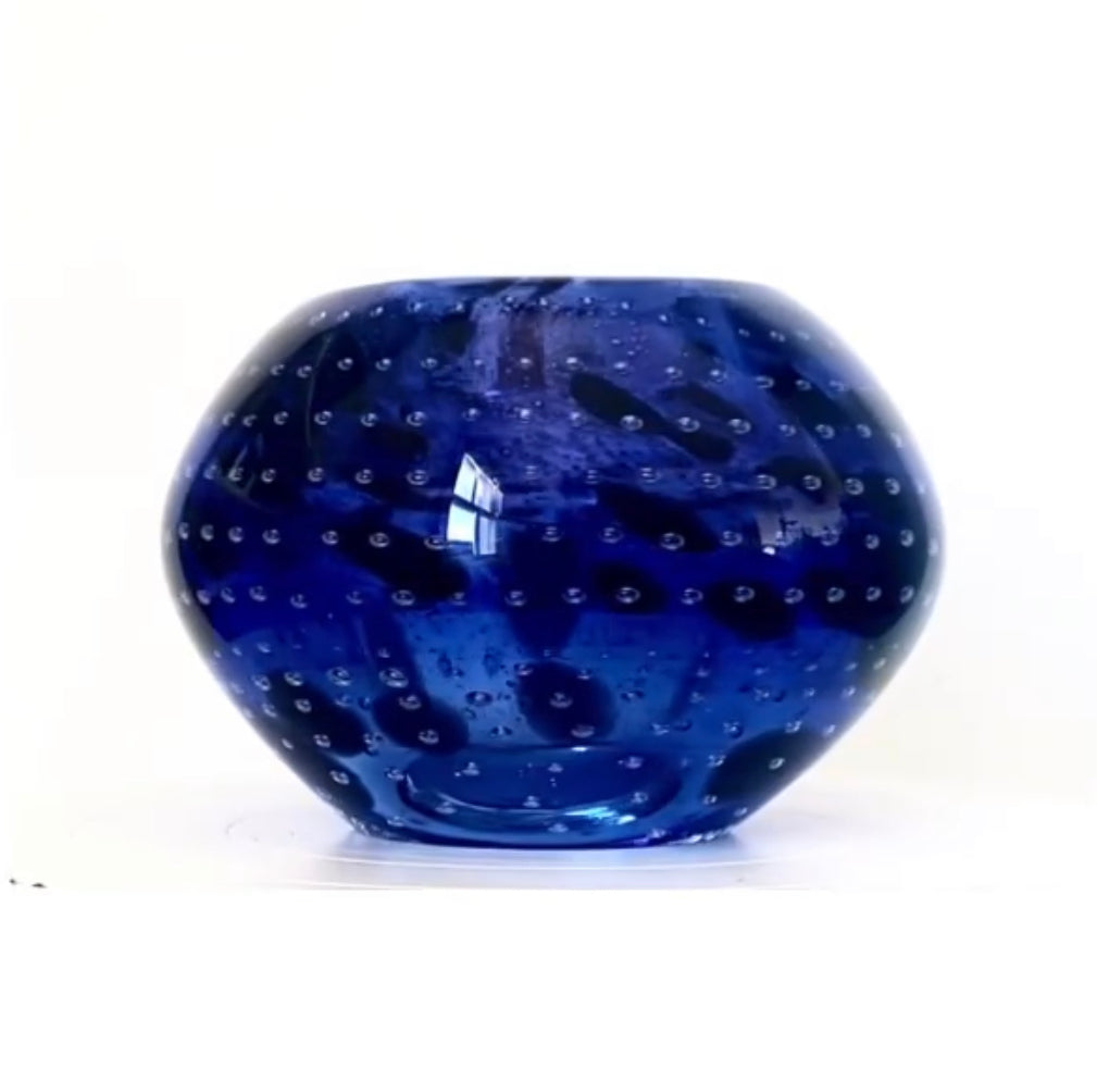 A Murano glass bowl in an inky deep violet with mottled flecks of black.