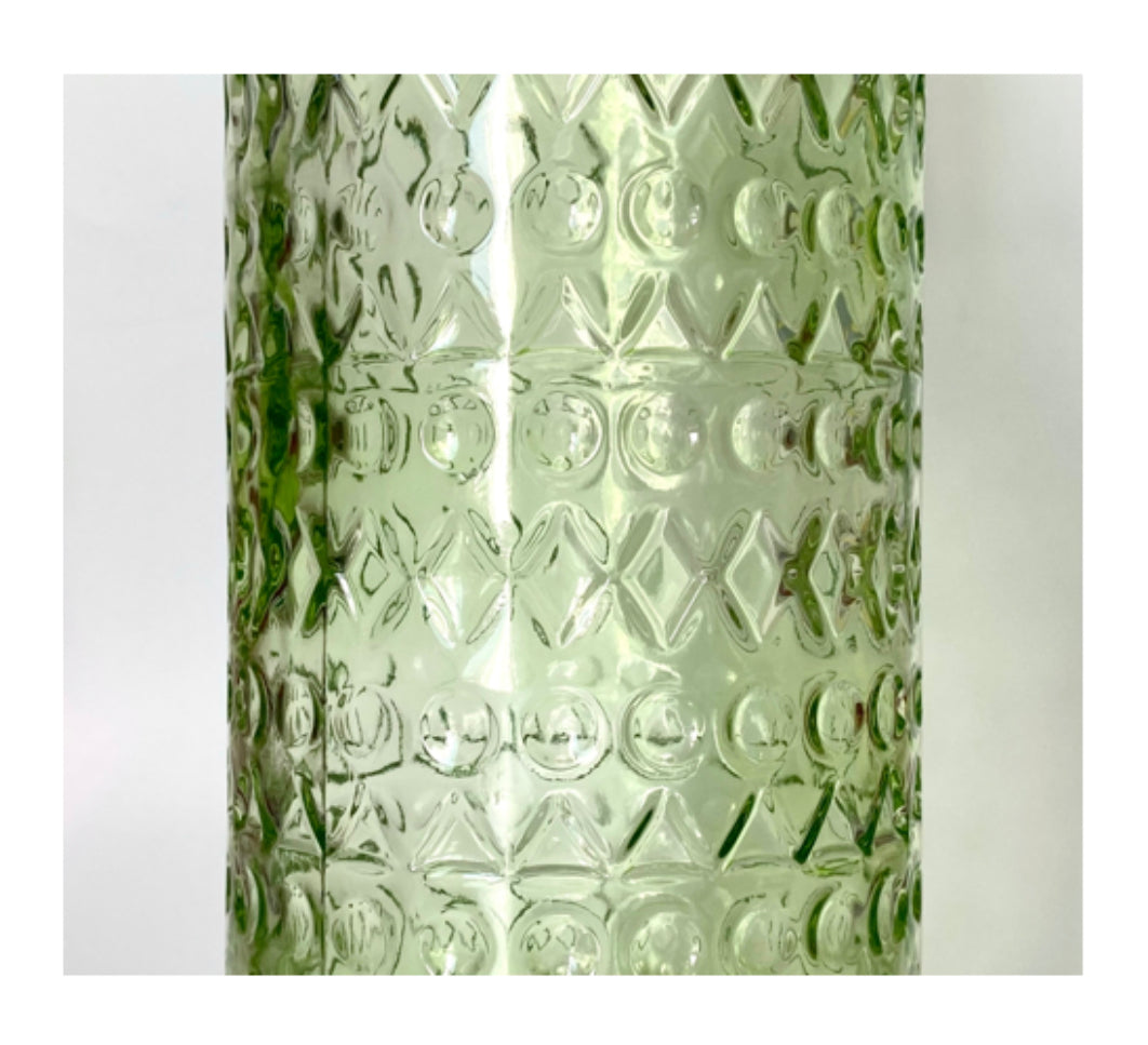 A Lime green glass vase , jug or bottle.