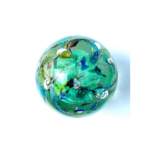 An enchanting world of colour inside a glass paperweight.