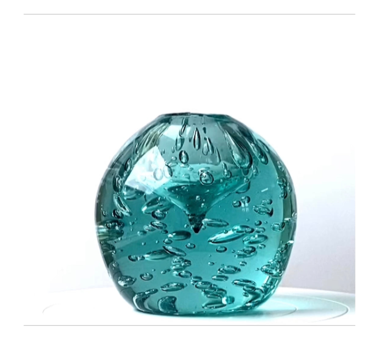 A Murano paperweight / room fragrance diffuser in sea green